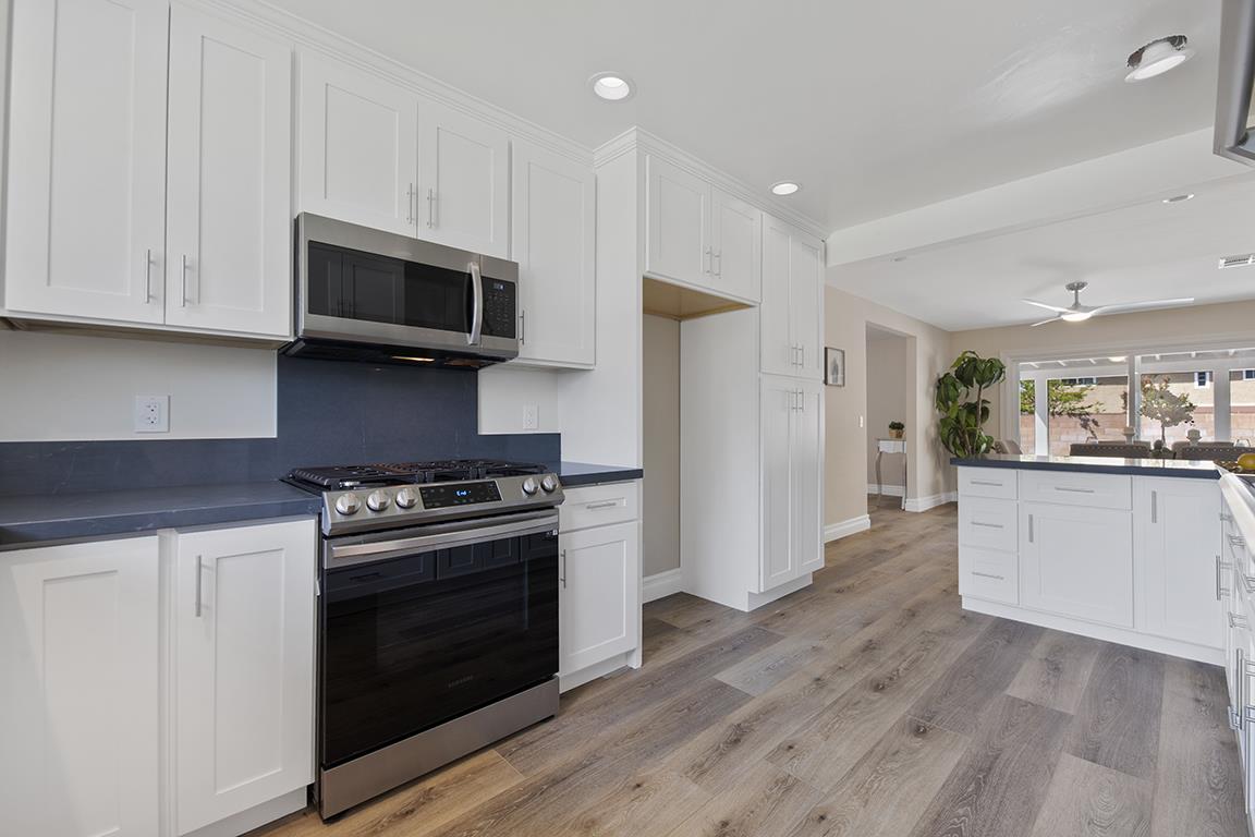 Cero Drive Santa Clarita, CA 91350 - Photo 36 of 45 a kitchen with stainless steel appliances granite countertop a stove a refrigerator and a microwave