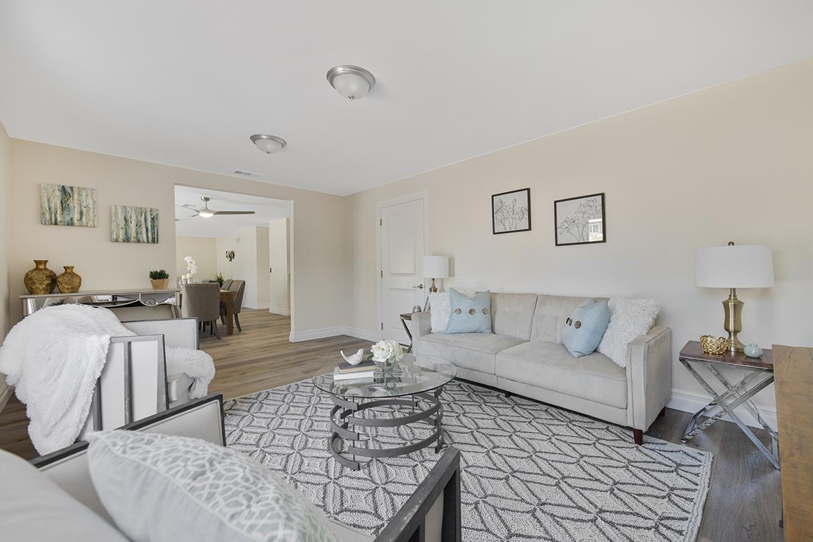 Cero Drive Santa Clarita, CA 91350 - Photo 39 of 45 a living room with furniture a rug and a lamp