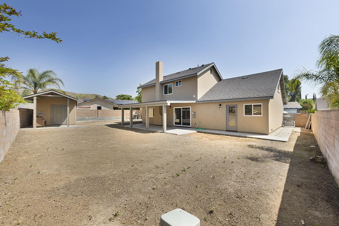 Cero Drive Santa Clarita, CA 91350 - Photo 41 of 45 a front view of a house with a yard and garage