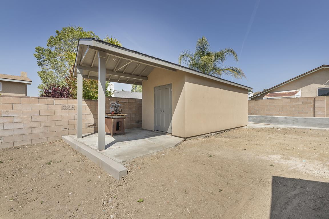 Cero Drive Santa Clarita, CA 91350 - Photo 45 of 45 a view of a house with a garage and potted plants