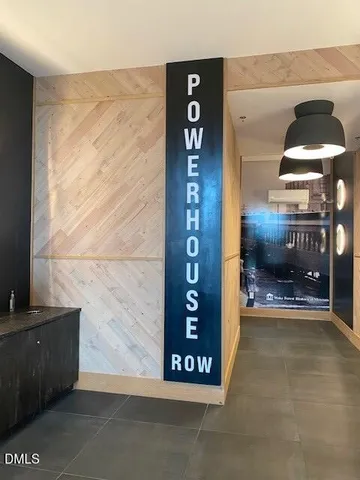 a view of a hallway with seating area