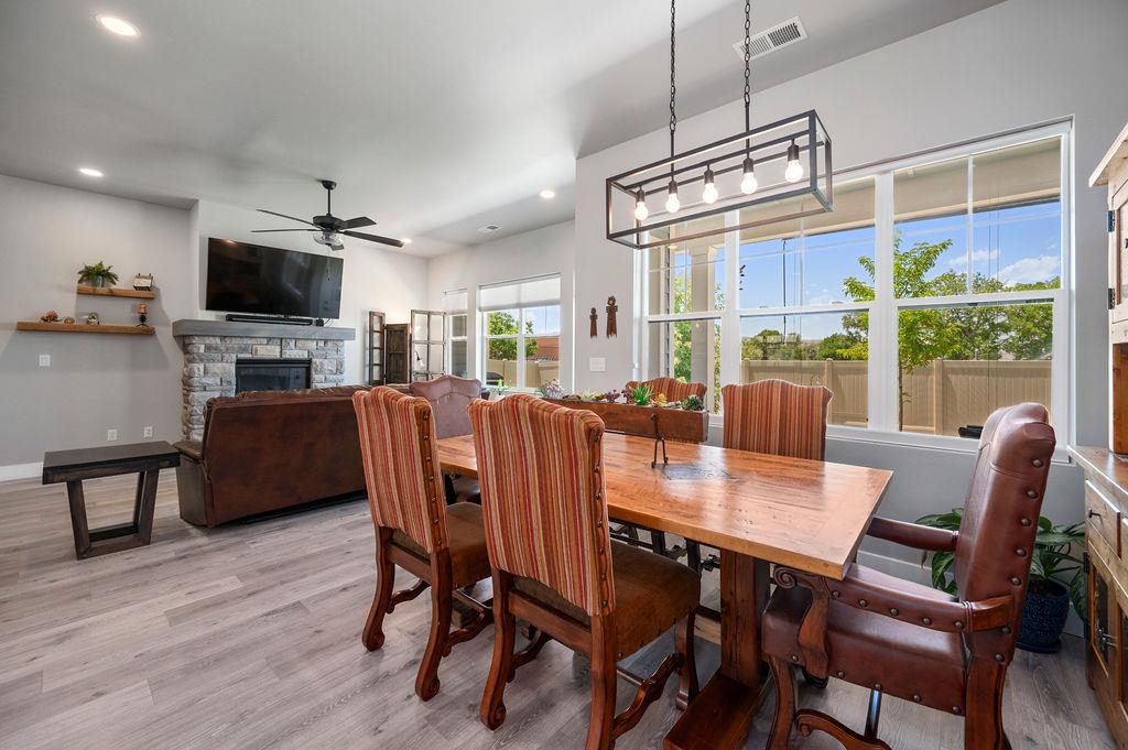813 Red Apple Road Grand Junction, CO 81505 - Photo 13 of 30 a view of a dining room with furniture window and wooden floor