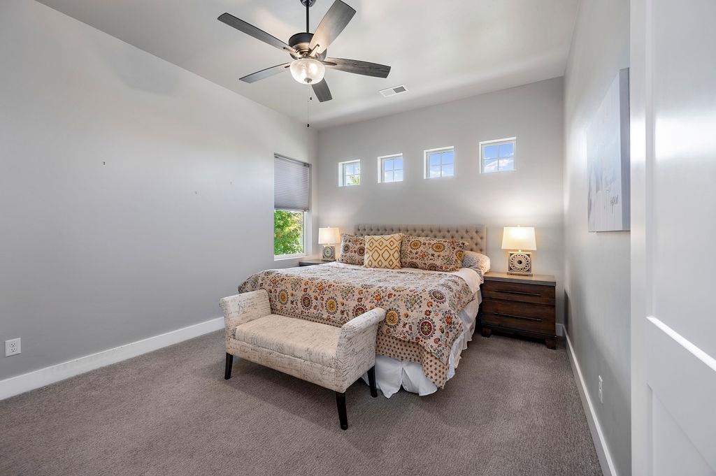 813 Red Apple Road Grand Junction, CO 81505 - Photo 22 of 30 a bedroom with a bed and a ceiling fan