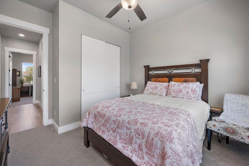 813 Red Apple Road Grand Junction, CO 81505 - Photo 30 of 30 a bedroom with a bed and a chandelier
