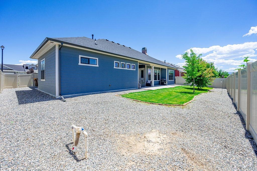 813 Red Apple Road Grand Junction, CO 81505 - Photo 5 of 30 a view of a house with a yard