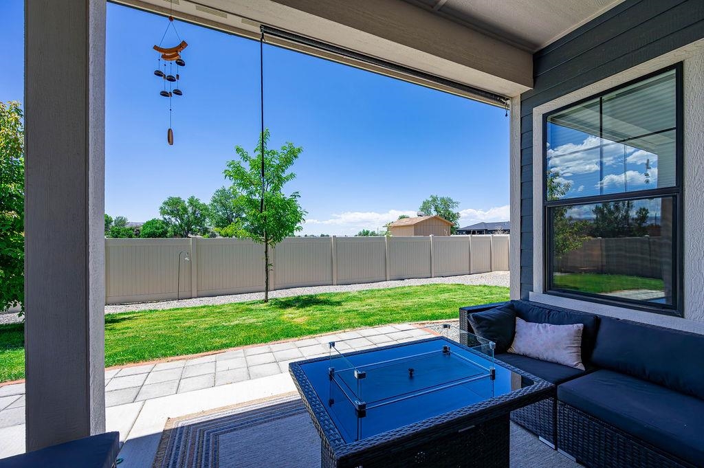 813 Red Apple Road Grand Junction, CO 81505 - Photo 7 of 30 a backyard of a house with a garden and outdoor seating