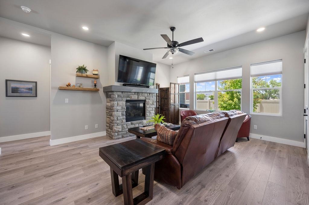 813 Red Apple Road Grand Junction, CO 81505 - Photo 10 of 30 a living room with furniture fireplace and a flat screen tv
