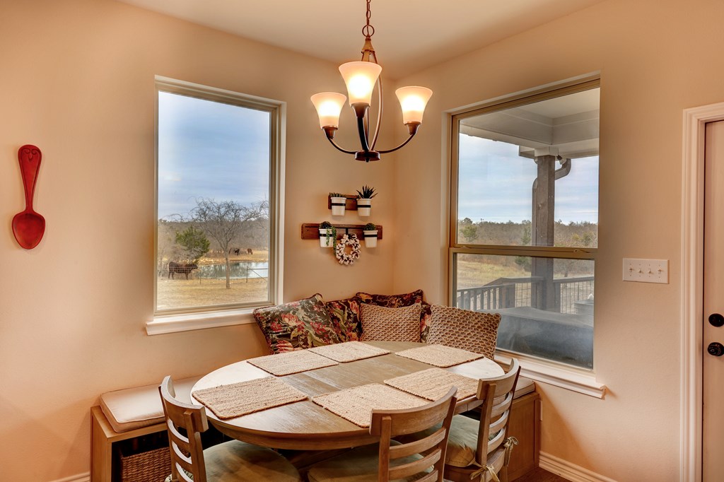 450 Jung Road Harper, TX 78631 - Photo 11 of 50 a view of a dining room with furniture window and outside view
