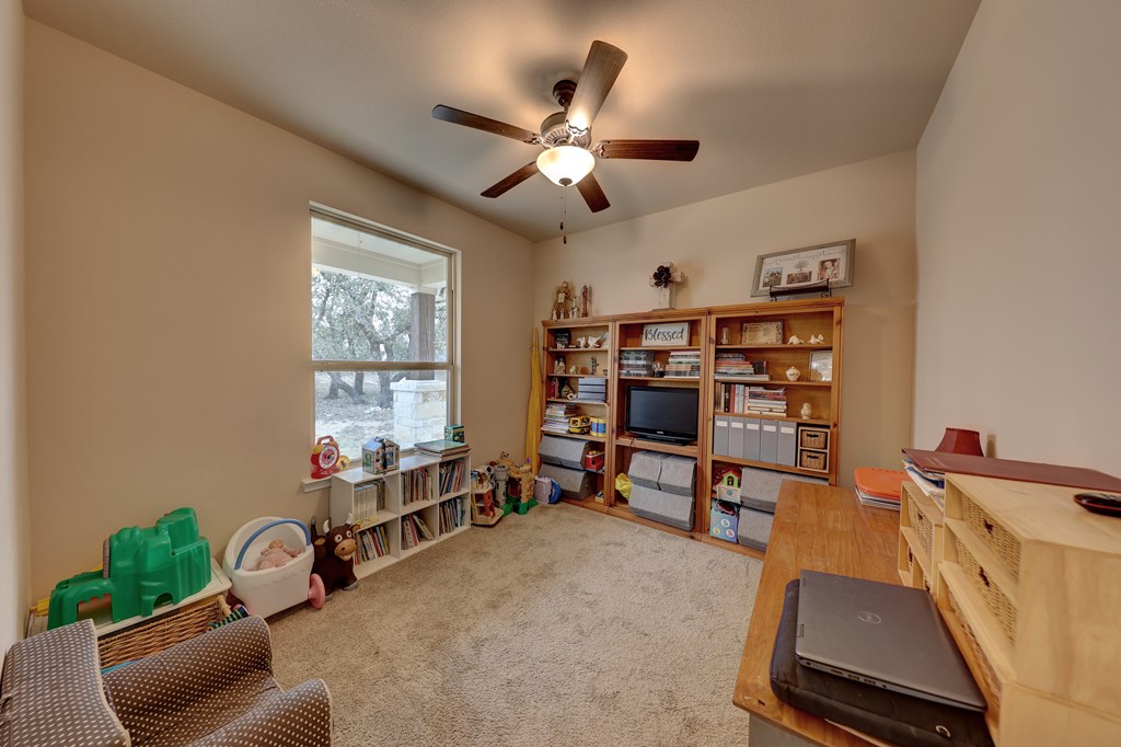 450 Jung Road Harper, TX 78631 - Photo 13 of 50 a work room with furniture and a window