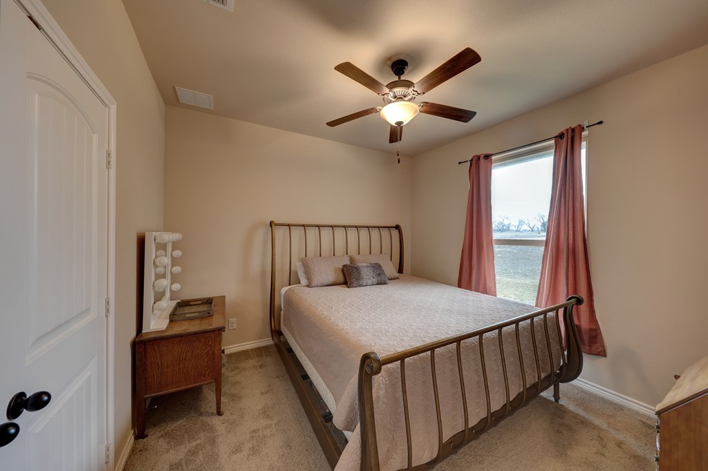 450 Jung Road Harper, TX 78631 - Photo 21 of 50 a bedroom with a bed and a window