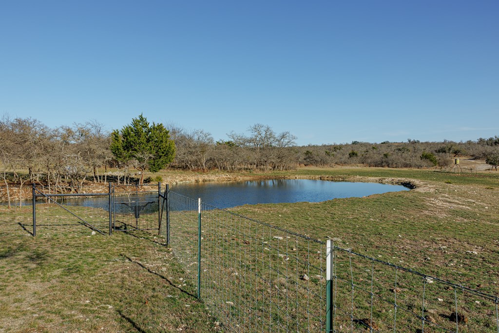 450 Jung Road Harper, TX 78631 - Photo 28 of 50 a view of a lake with houses in outdoor space