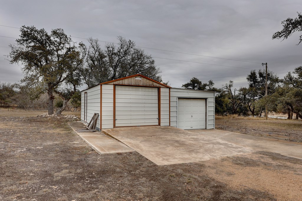 450 Jung Road Harper, TX 78631 - Photo 46 of 50 a view of a house with a garage