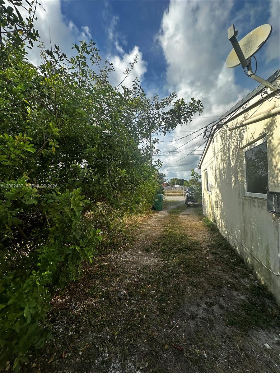 11862 Southwest 212th Street, Unit 11862 Miami, FL 33177 - Photo 23 of 24 a view of outdoor space and garden