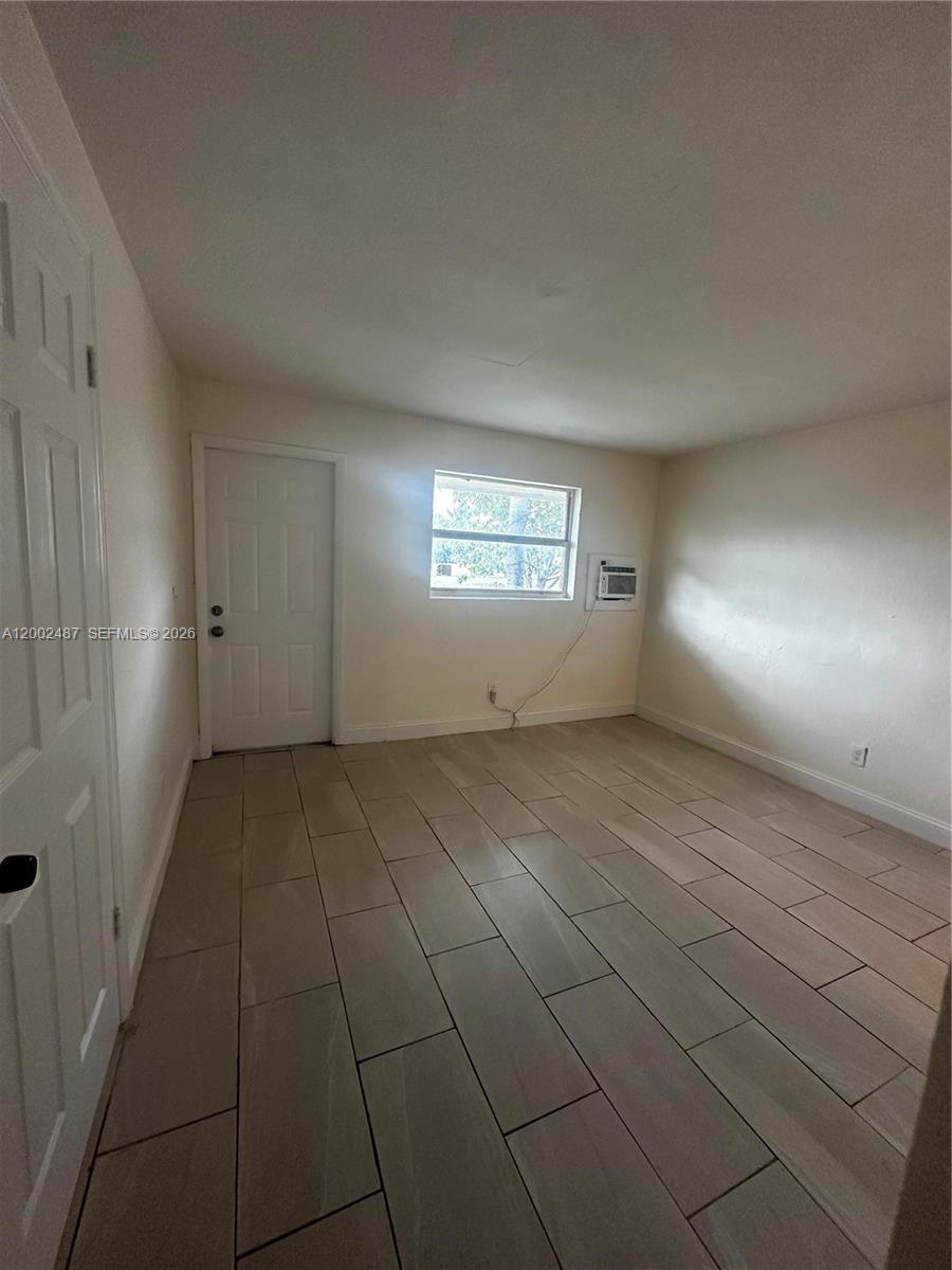 11862 Southwest 212th Street, Unit 11862 Miami, FL 33177 - Photo 4 of 24 a view of an empty room and window