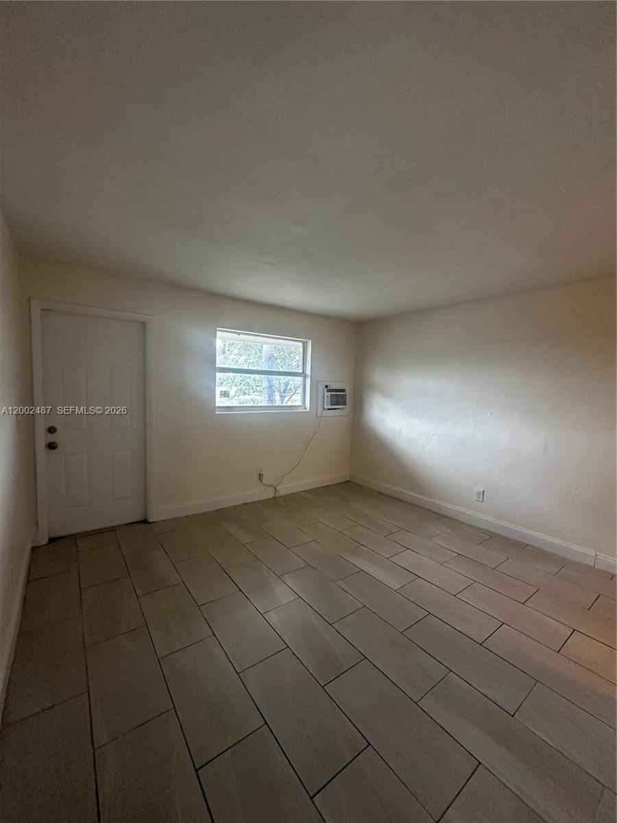 11862 Southwest 212th Street, Unit 11862 Miami, FL 33177 - Photo 6 of 24 a view of an empty room and window