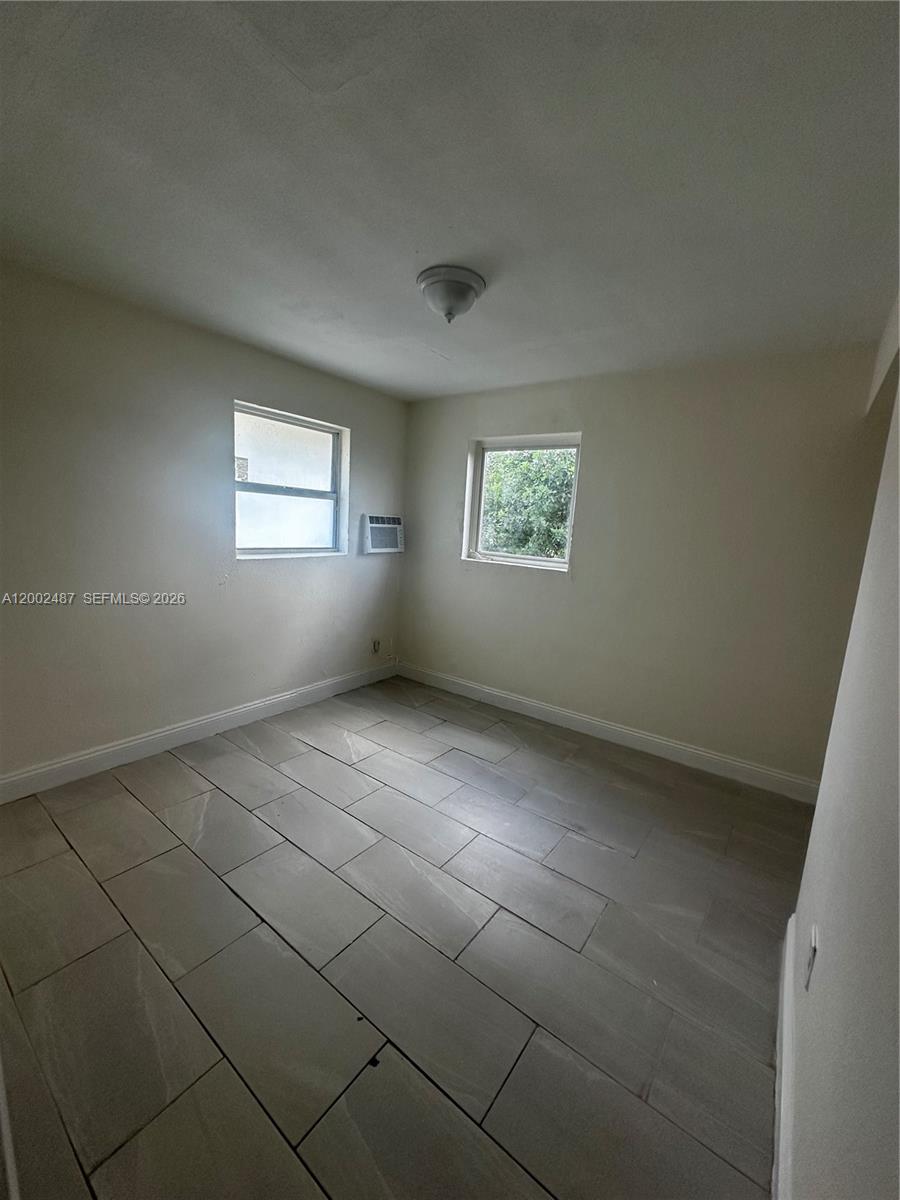 11862 Southwest 212th Street, Unit 11862 Miami, FL 33177 - Photo 7 of 24 a view of an empty room with a window