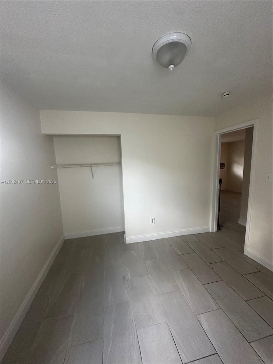 11862 Southwest 212th Street, Unit 11862 Miami, FL 33177 - Photo 9 of 24 a view of an empty room