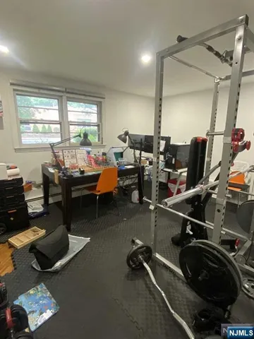 a room with gym equipment and a large window