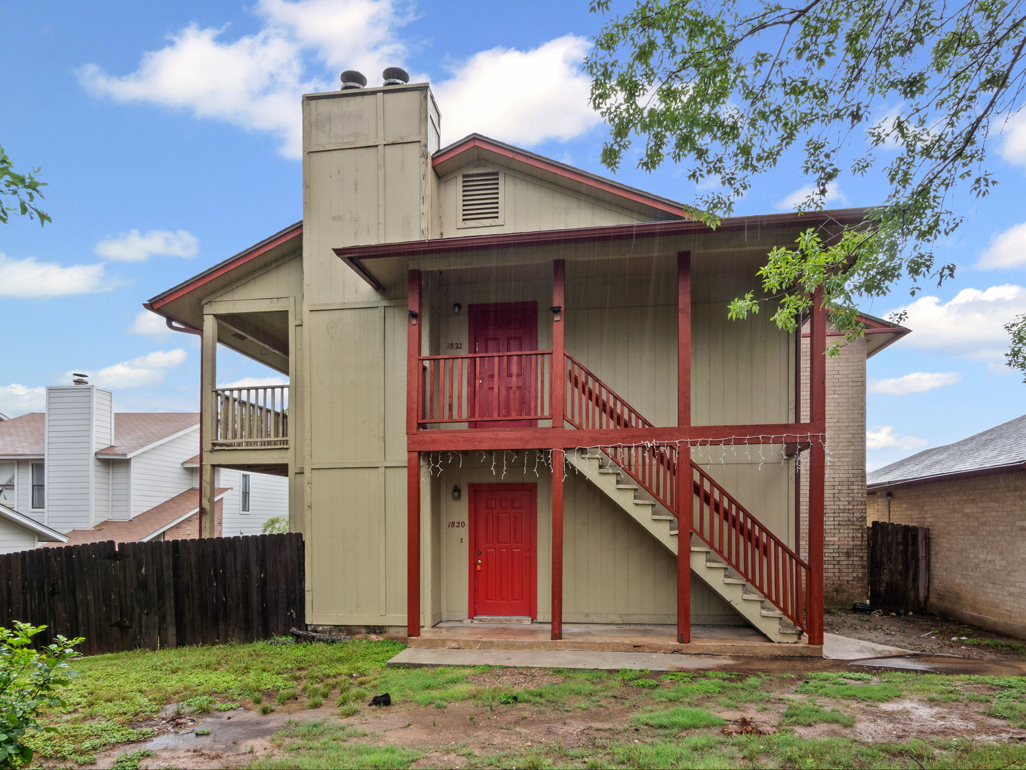 1816 Rawhide Loop, Unit 1822 Round Rock, TX 78681 - Photo 1 of 17 Back of house featuring stairway