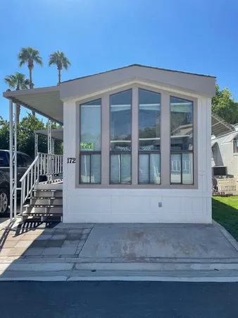a front view of a house with a porch
