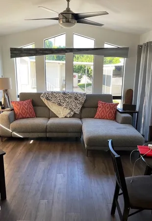 a living room with furniture and a large window