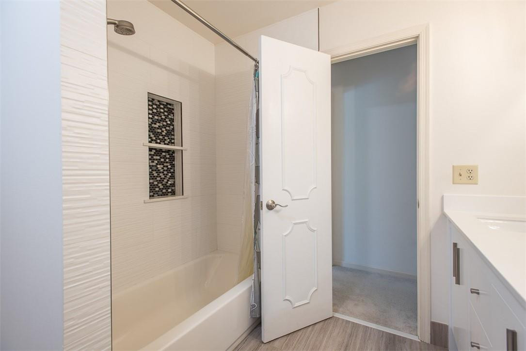 22790 Wilderness Way Boca Raton, FL 33428 - Photo 22 of 31 a bathroom with a bathtub and shower