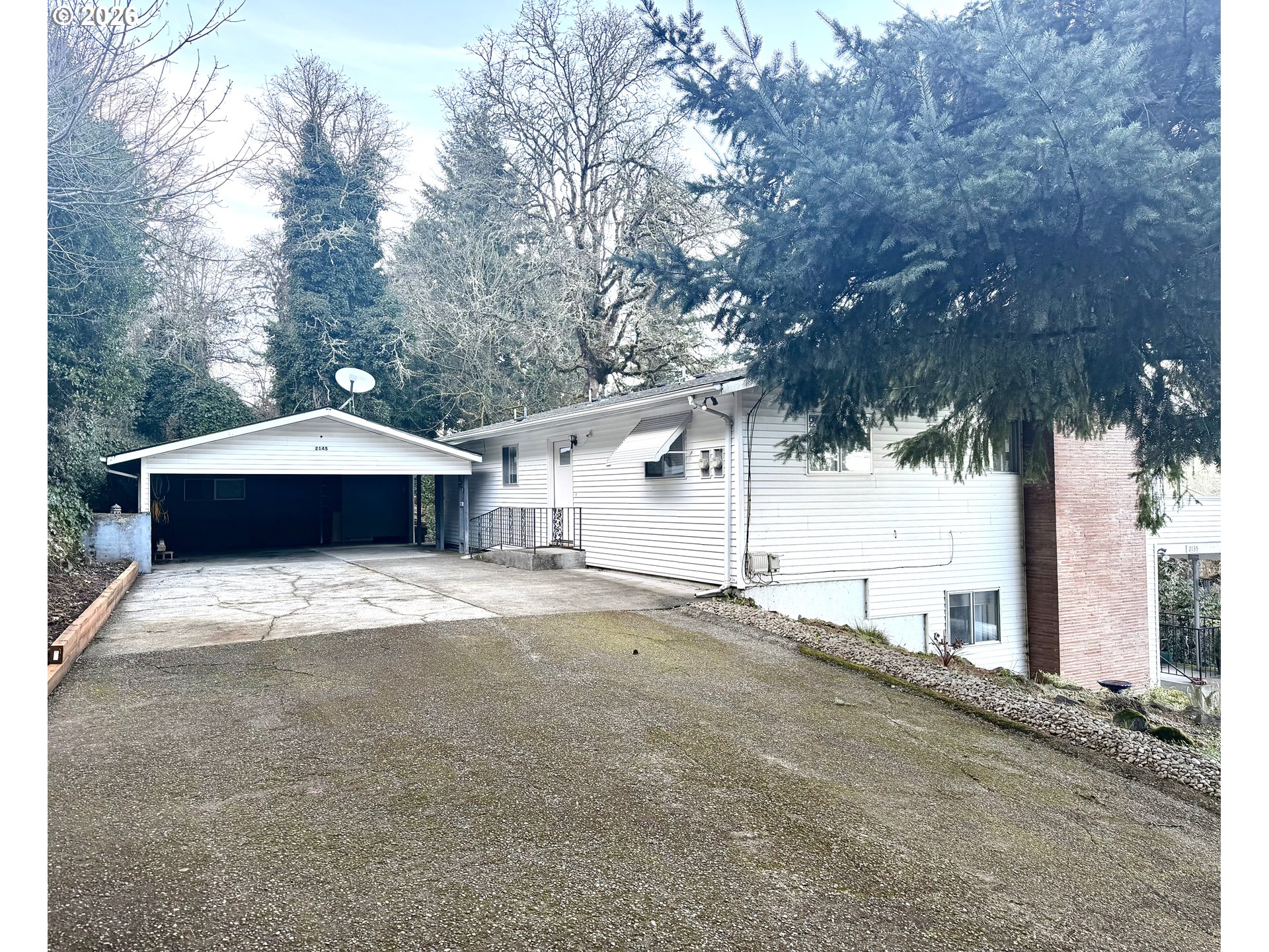 2145 Webb Street West Linn, OR 97068 - Photo 1 of 46 a house with trees in front of it