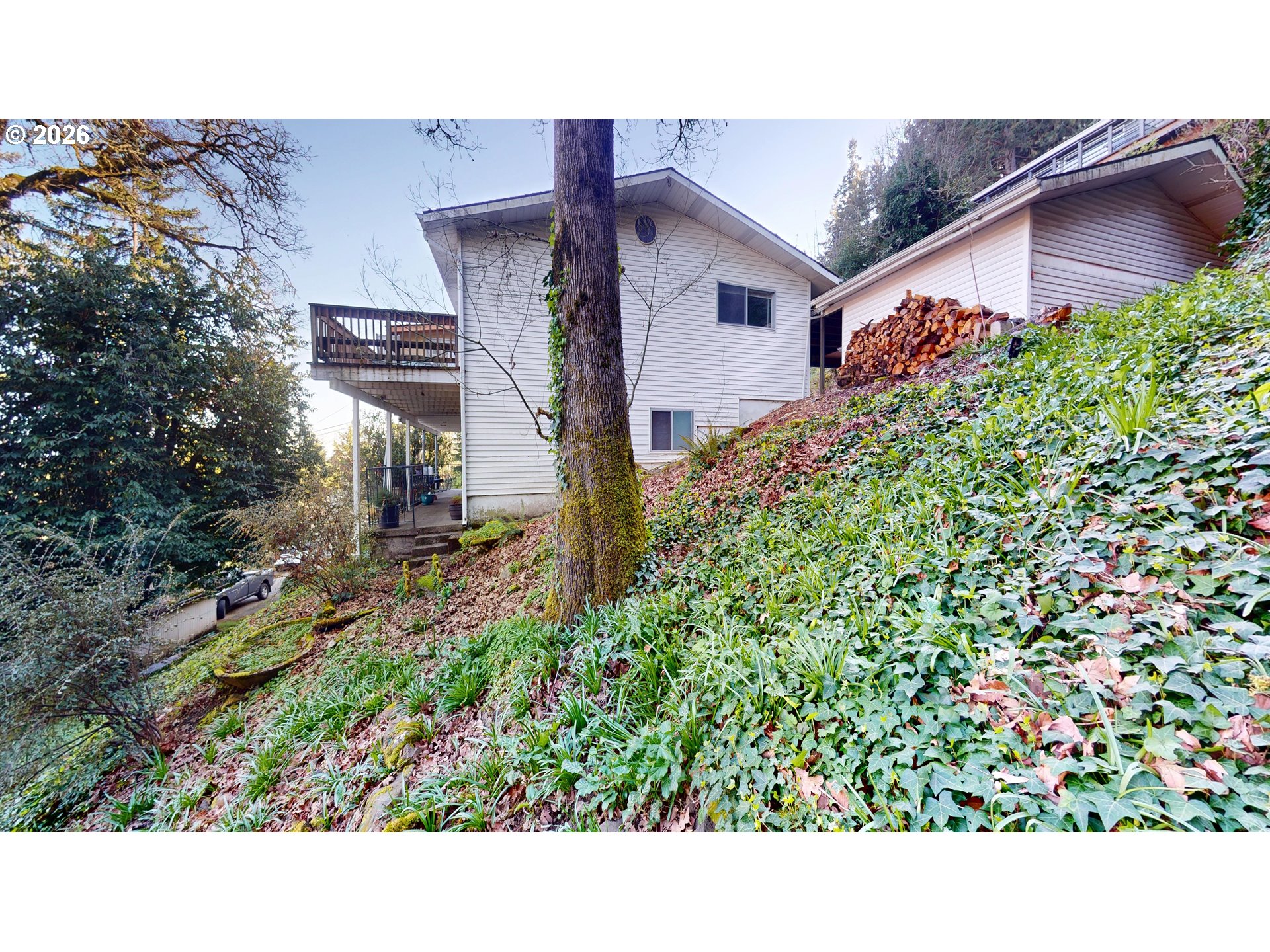 2145 Webb Street West Linn, OR 97068 - Photo 45 of 46 a black and white house with a yard and a wooden fence