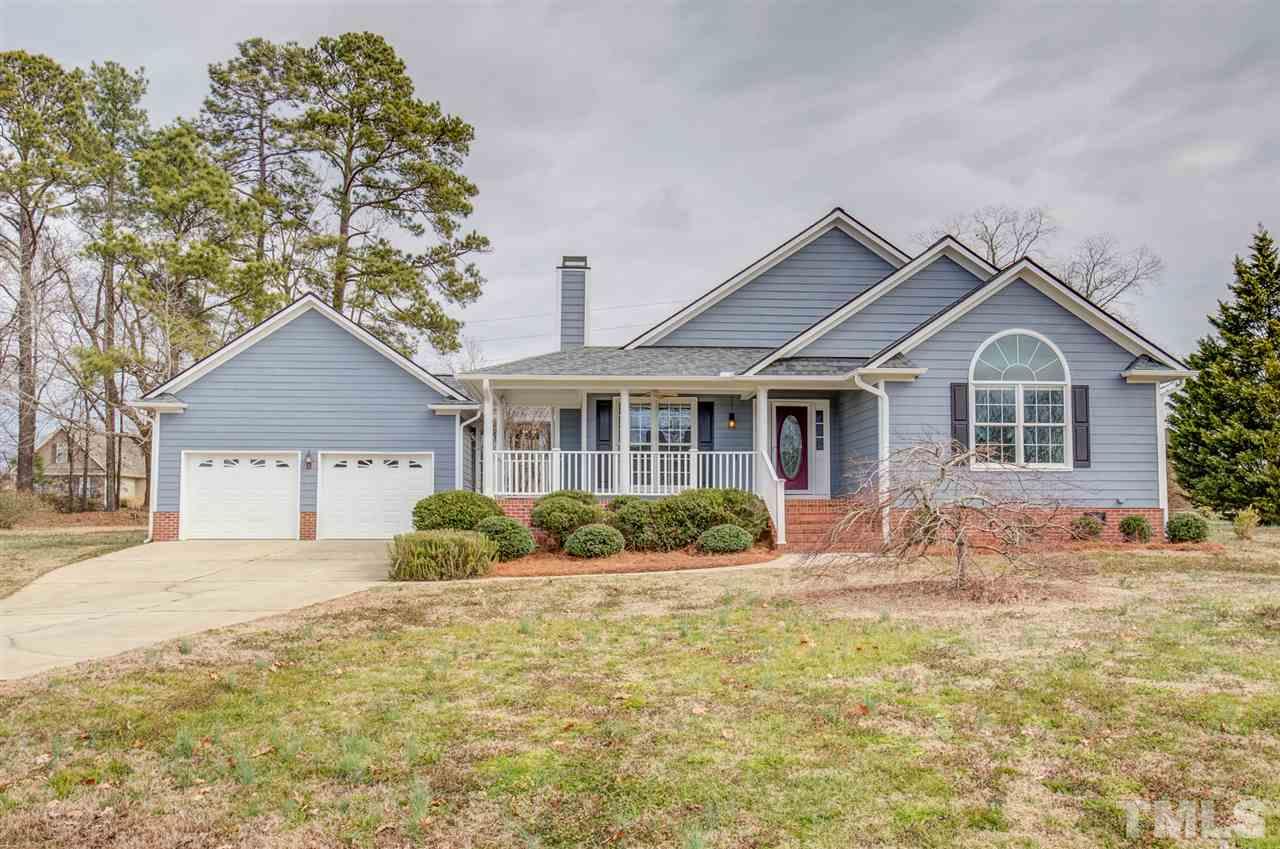 1020 Transom Court Raleigh, NC 27603 - Photo 2 of 30 a front view of a house with a yard and potted plants