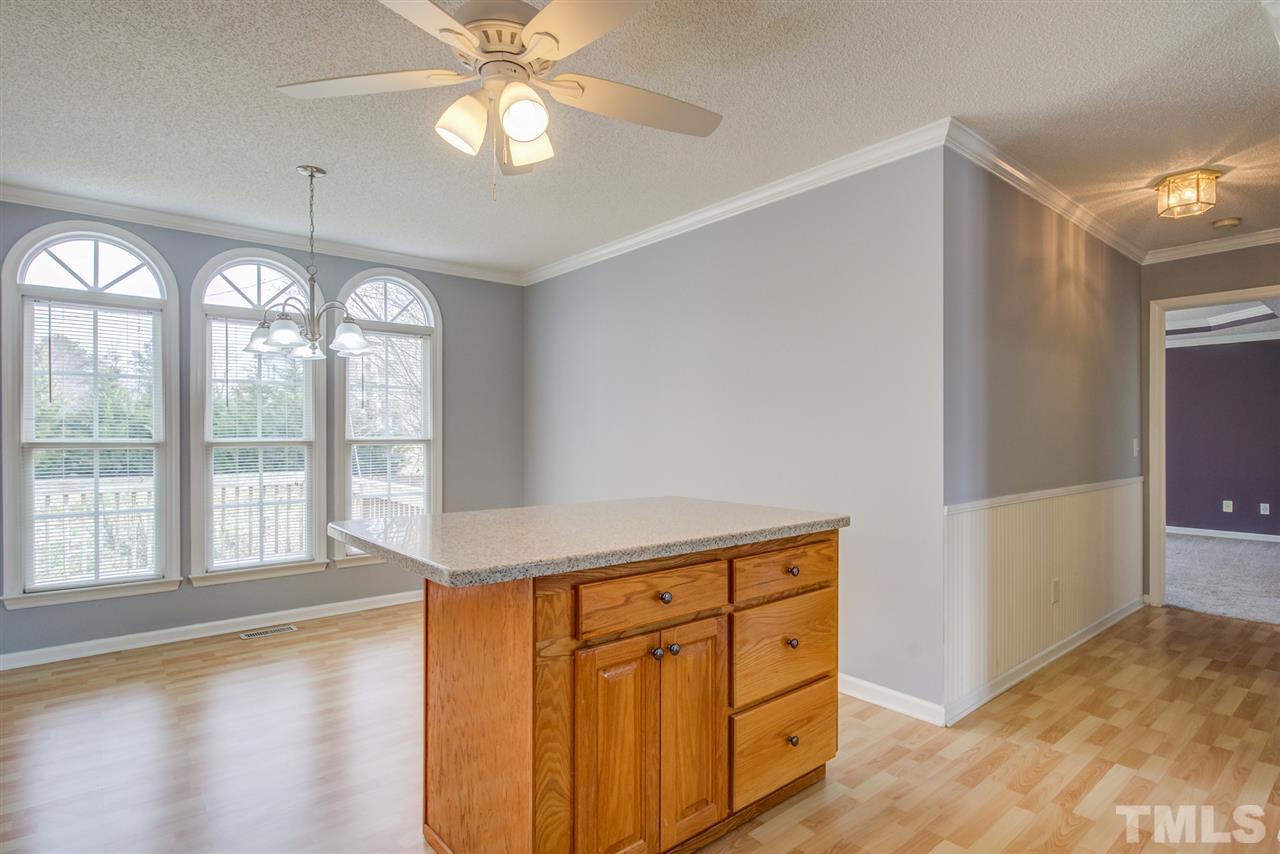 1020 Transom Court Raleigh, NC 27603 - Photo 14 of 30 a view of a kitchen with wooden cabinet and a window