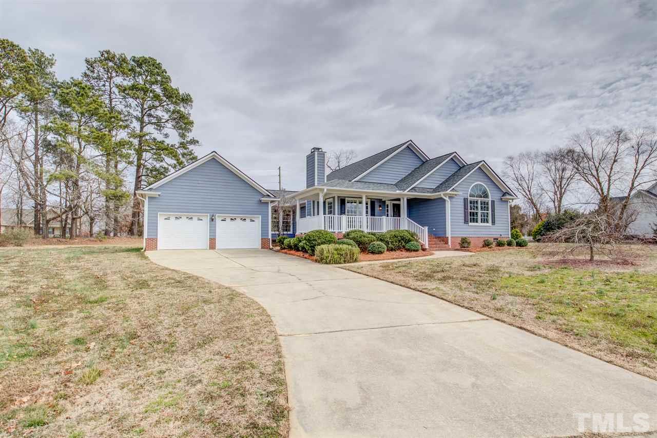 1020 Transom Court Raleigh, NC 27603 - Photo 3 of 30 a front view of a house with a yard and garage