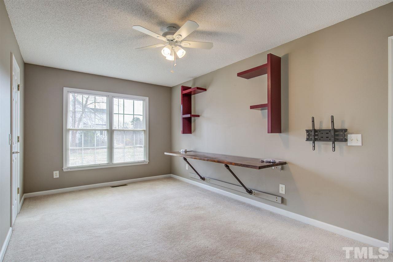 1020 Transom Court Raleigh, NC 27603 - Photo 26 of 30 an empty room with windows and fan