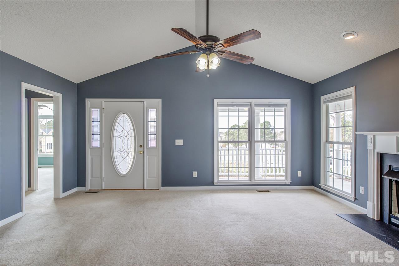 1020 Transom Court Raleigh, NC 27603 - Photo 9 of 30 a view of a livingroom with a fireplace window and wooden floor