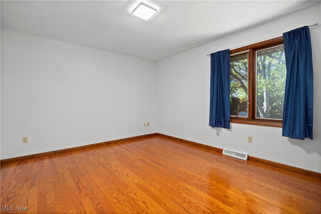 1711 Gulf Road Elyria, OH 44035 - Photo 33 of 50 Spare room featuring light wood finished floors and baseboards