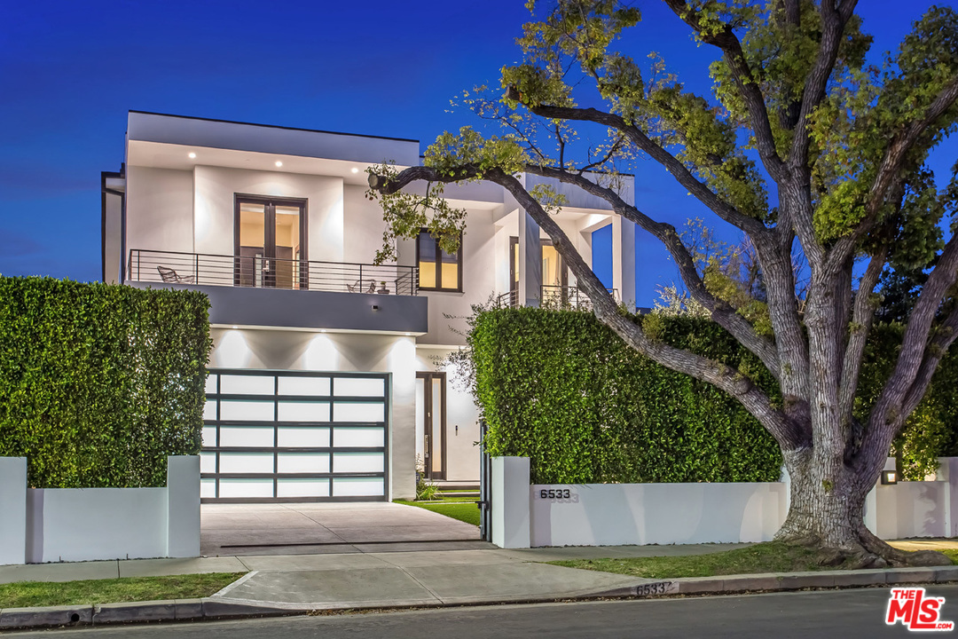 6533 Colgate Avenue Los Angeles, CA 90048 - Photo 1 of 19 a front view of a house with a yard