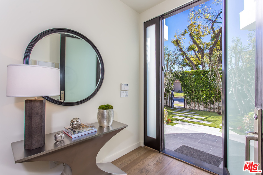 6533 Colgate Avenue Los Angeles, CA 90048 - Photo 11 of 19 a front view of a house with garden