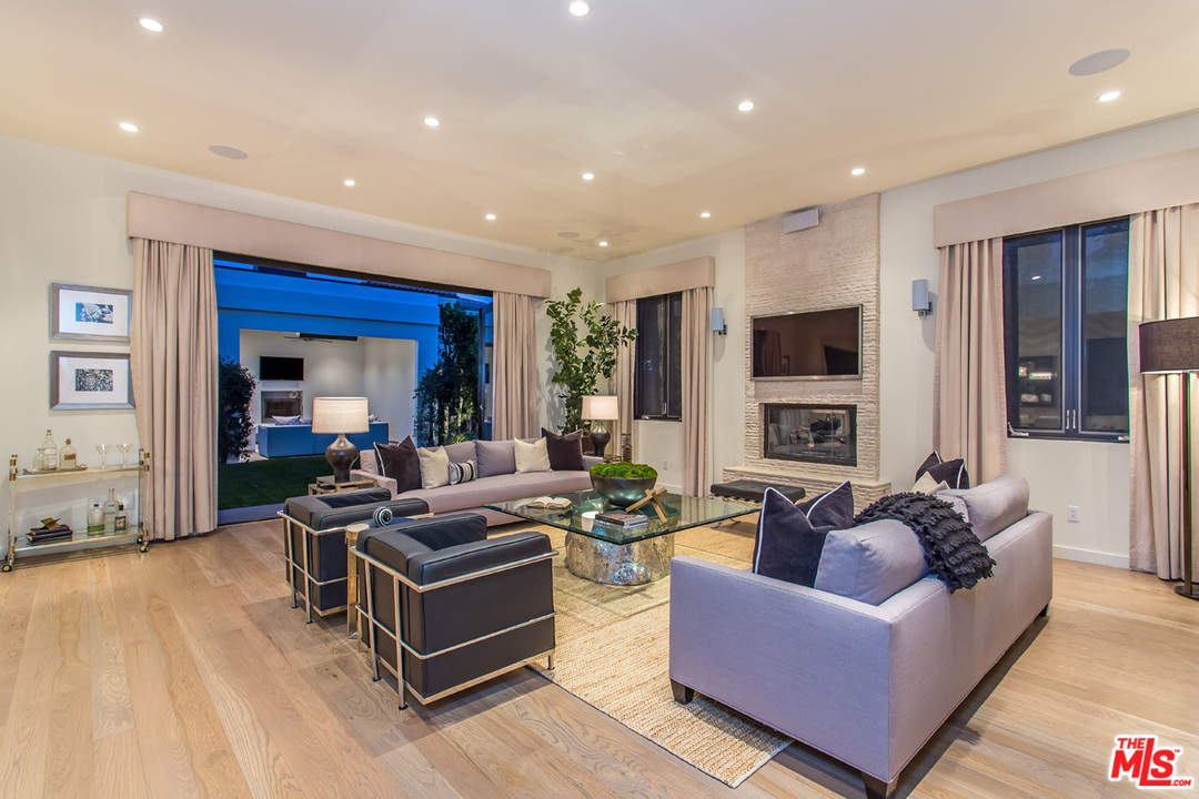 6533 Colgate Avenue Los Angeles, CA 90048 - Photo 3 of 19 a living room with fireplace furniture and a wooden floor