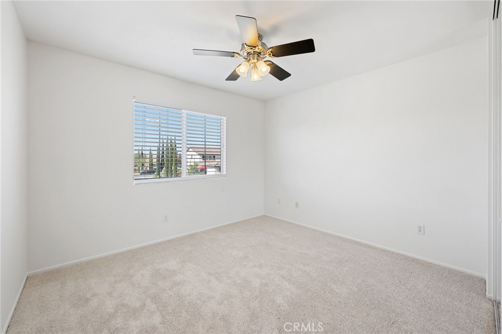 33751 Abbey Road Temecula, CA 92592 - Photo 22 of 41 an empty room with a window and a fan