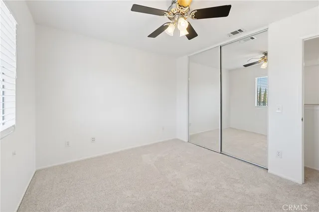 a view of a hallway with closet
