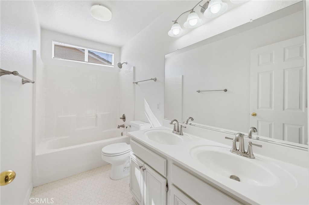 33751 Abbey Road Temecula, CA 92592 - Photo 25 of 41 a bathroom with a sink a toilet and shower