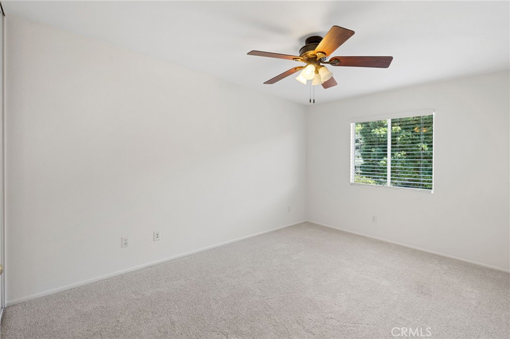 33751 Abbey Road Temecula, CA 92592 - Photo 36 of 41 an empty room with window and ceiling fan