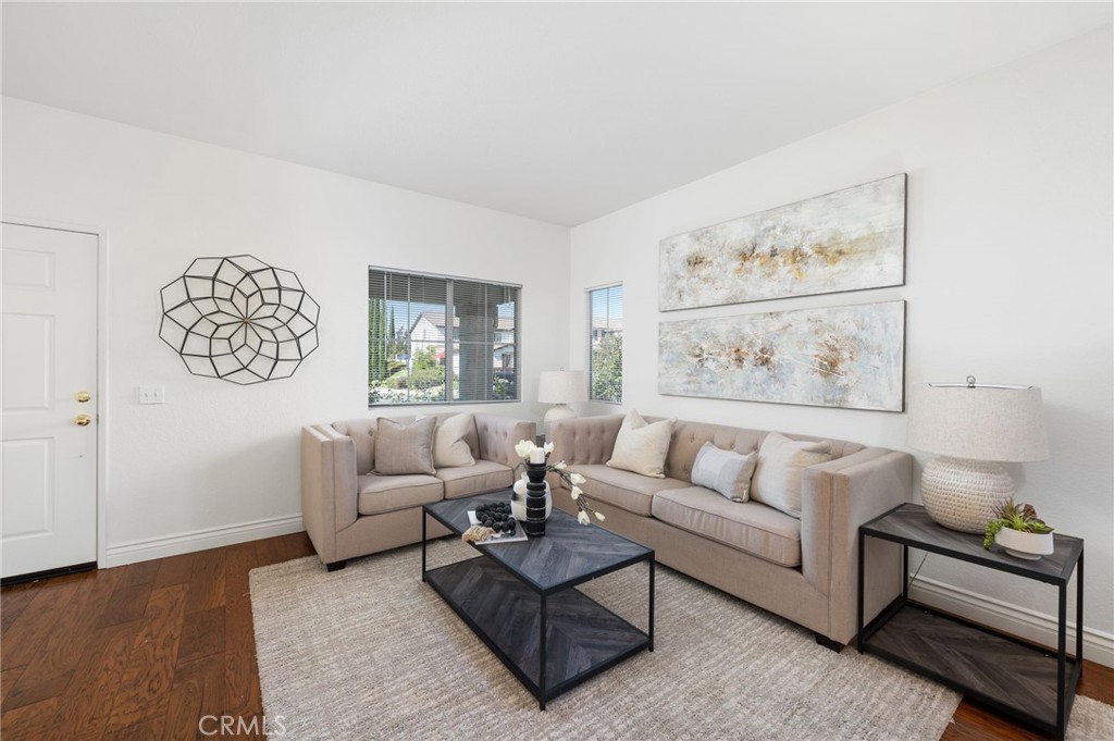 33751 Abbey Road Temecula, CA 92592 - Photo 6 of 41 a living room with furniture and a wall painting