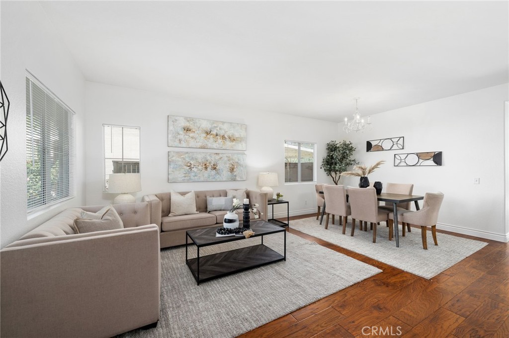 33751 Abbey Road Temecula, CA 92592 - Photo 7 of 41 a living room with furniture wooden floor and a table