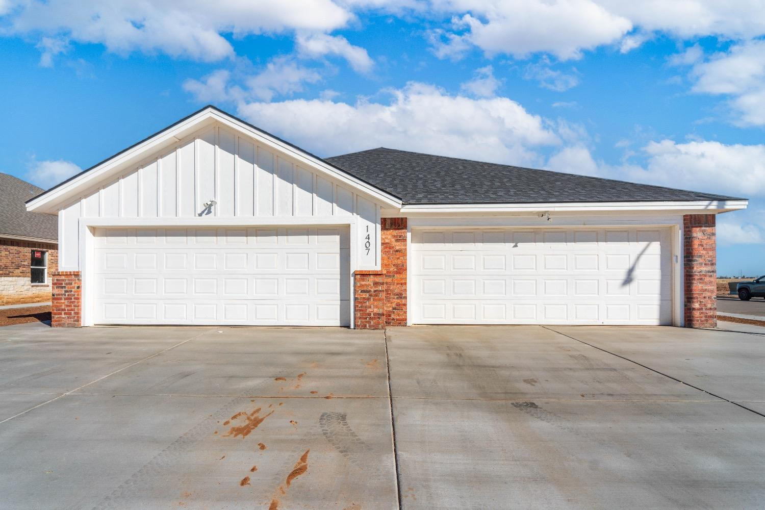 1407 17th Street, Unit AB Shallowater, TX 79363 - Photo 1 of 33 a view of a house with a garage