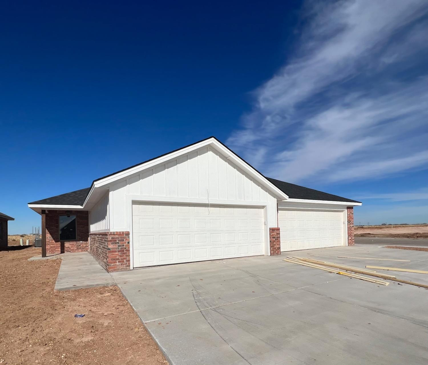 1407 17th Street, Unit AB Shallowater, TX 79363 - Photo 13 of 33 a view of garage and yard