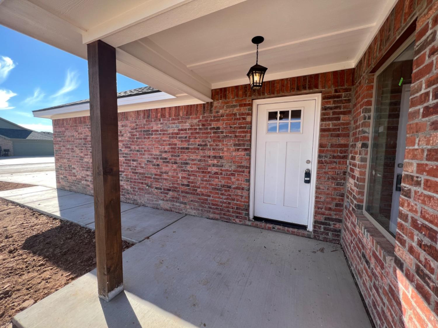 1407 17th Street, Unit AB Shallowater, TX 79363 - Photo 16 of 33 a view of a hallway with brick walls