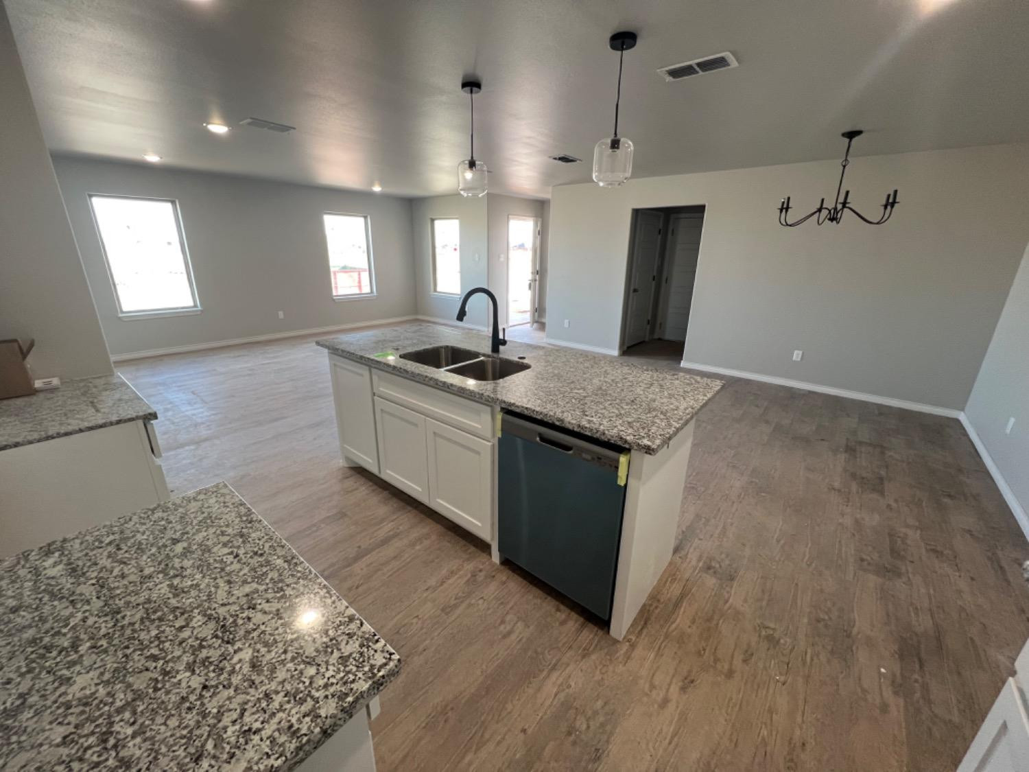 1407 17th Street, Unit AB Shallowater, TX 79363 - Photo 20 of 33 a kitchen with a sink stove and refrigerator