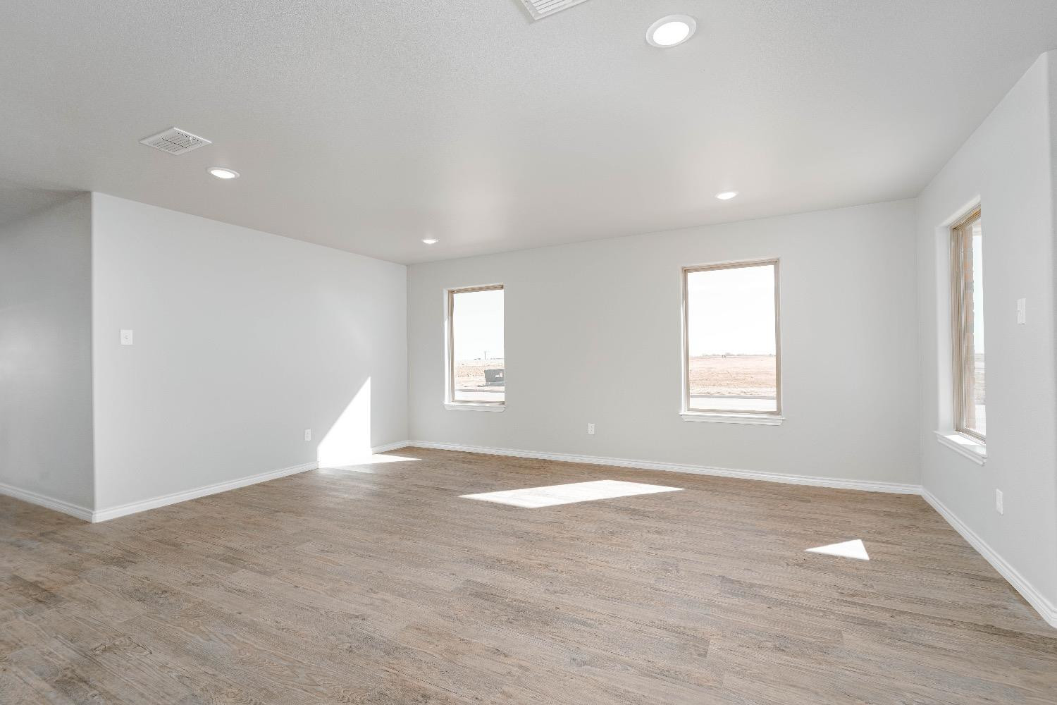 1407 17th Street, Unit AB Shallowater, TX 79363 - Photo 4 of 33 a view of an empty room with a window