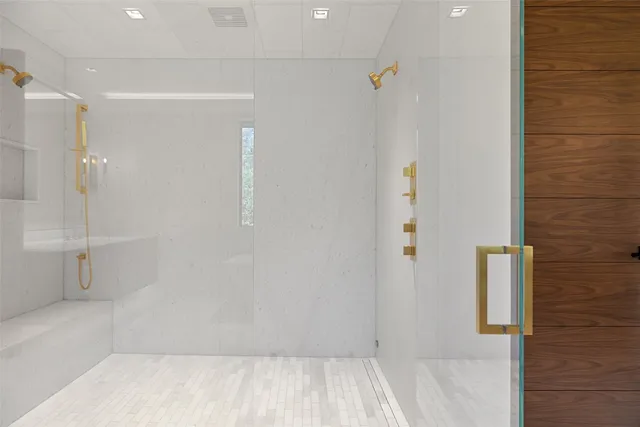 a view of entryway with a floor to ceiling window and wooden floor