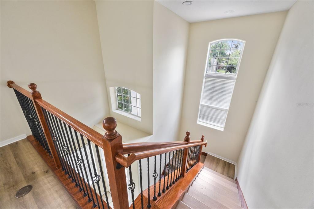 551 Terrace Spring Drive Orlando, FL 32828 - Photo 17 of 41 a view of a hallway with windows